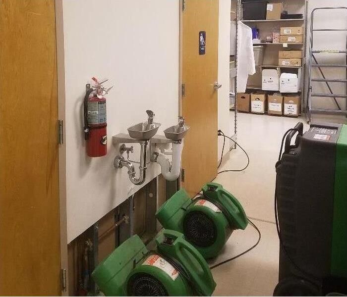 equipment set up to help repair water damage in local facility