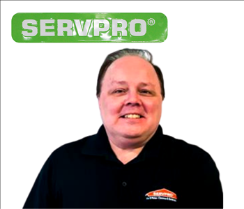 Bill Repsel for SERVPRO photo on white wall