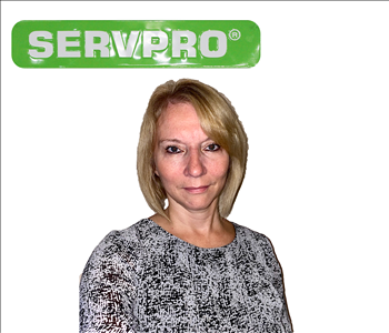 Janice Weyant for SERVPRO photo on white wall, female employee with blonde hair